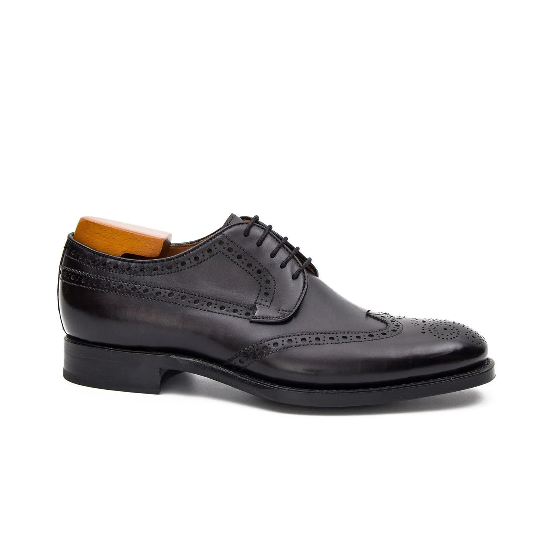 Goodyear Welt Brogue Shoes by DV DIVINCH, black calfskin leather, U-wing toe with brogue perforations, side view.