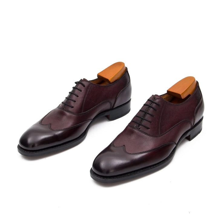 Goodyear Welt Oxford Shoes in dark burgundy calfskin leather, featuring intricate brogue detailing and a classic lace-up design.