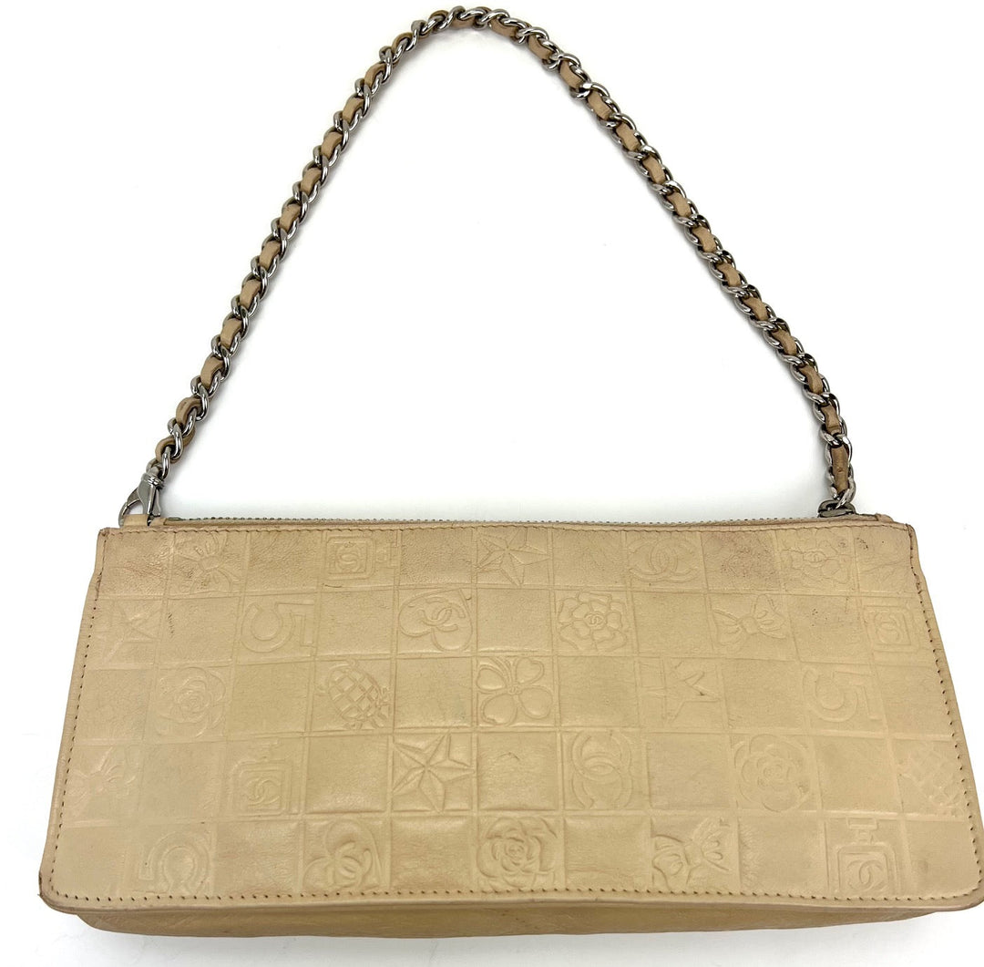 Beige handbag with chain handle on a white background