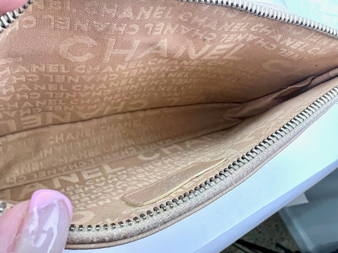 Close-up of a Chanel handbag with visible branding inside.