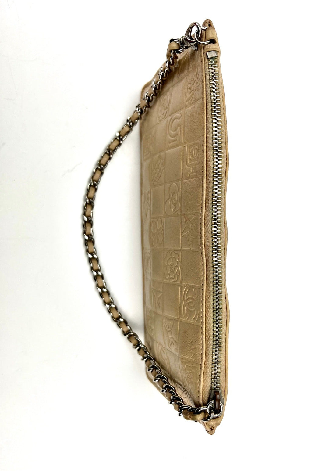 Beige handbag with chain strap on a white background
