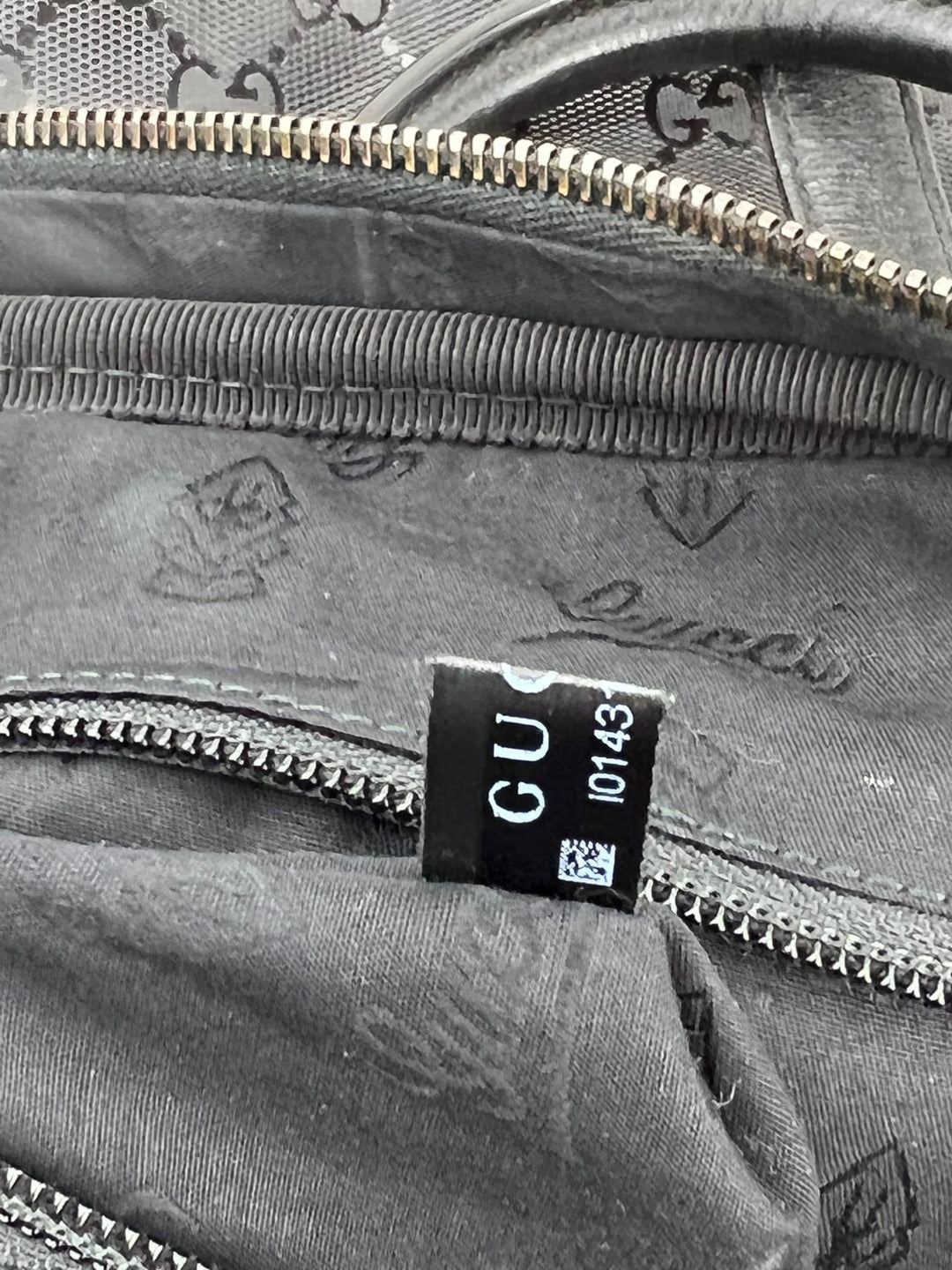 Close-up view of the interior label of Gucci Briefcase GG Imprime Coated Canvas Black Monogram Business Bag Preowned.