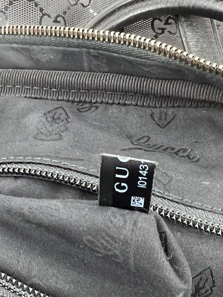 Close-up view of the interior label of Gucci Briefcase GG Imprime Coated Canvas Black Monogram Business Bag Preowned.