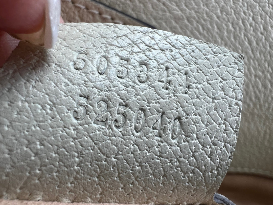 Close-up of textured surface with embossed numbers
