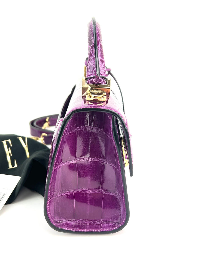 Exclusive Stalvey Top Handle 2.0 Alligator Bag Crossbody Luxury Bag side view showcasing vibrant purple alligator skin.