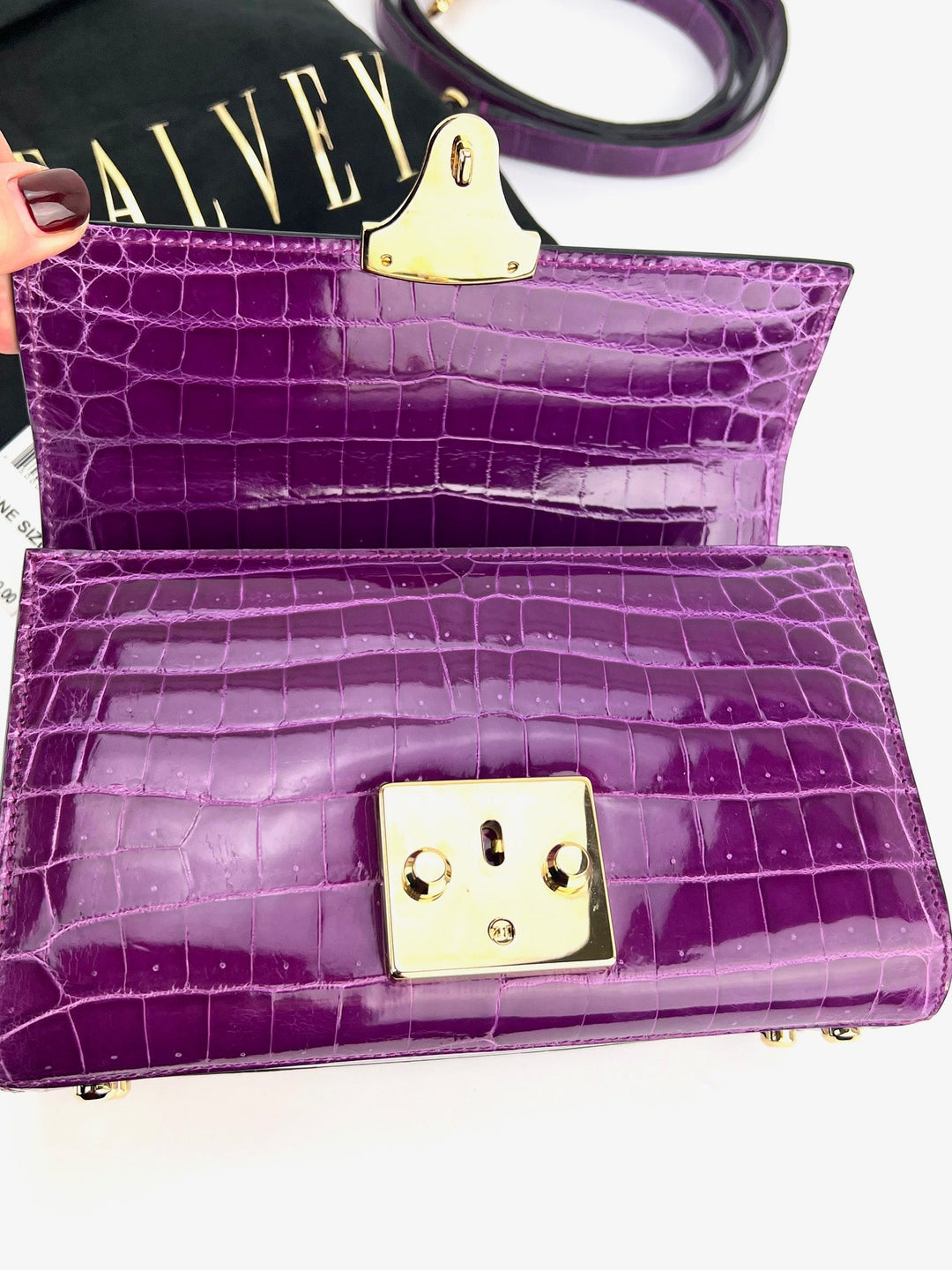 Exclusive Stalvey Top Handle 2.0 Alligator Bag Crossbody Luxury Bag interior in purple color with gold lock closure.