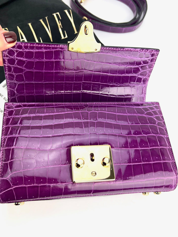 Exclusive Stalvey Top Handle 2.0 Alligator Bag Crossbody Luxury Bag interior in purple color with gold lock closure.