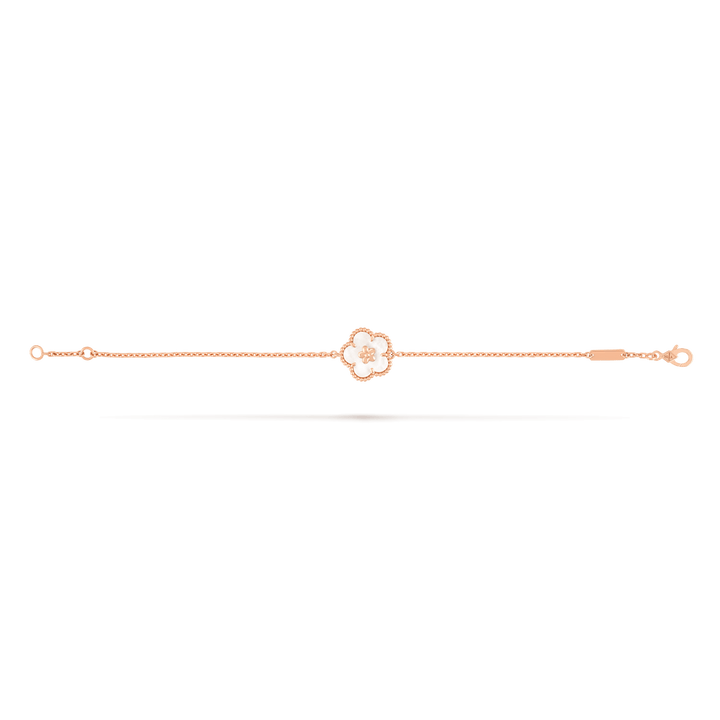 Van Cleef & Arpels Lucky Spring bracelet, plum blossom 18K rose gold, Mother-of-pearl on display.