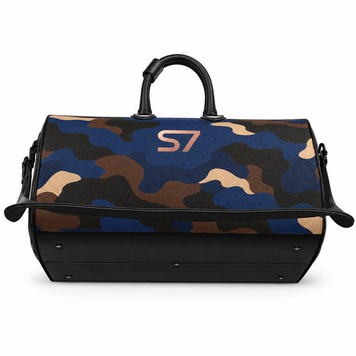 S7 Midnight Terrain leather duffle bag with midnight-blue, navy, beige, brown and black camouflage, a centered rose-gold S7 monogram and black trim.