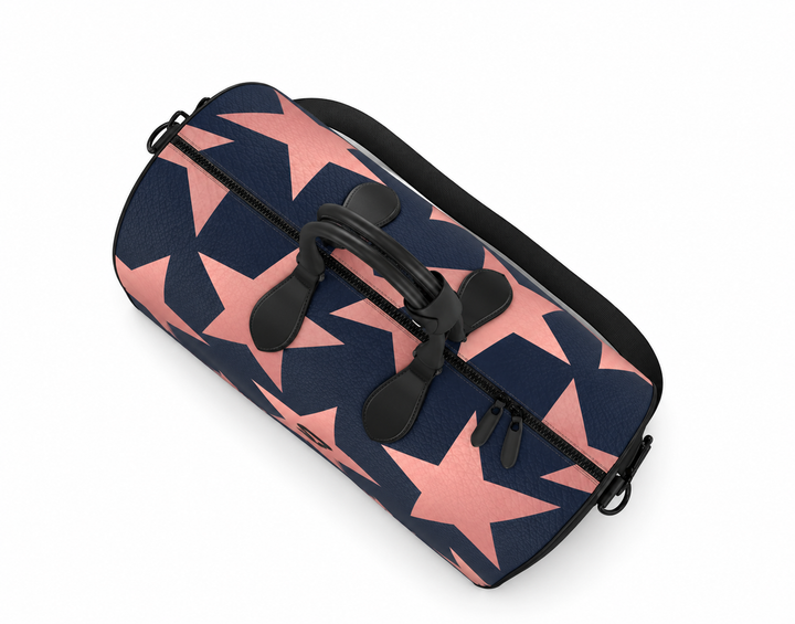 S7 Stella Midnight leather duffle bag with oversized rose-gold stars on midnight blue and a centered black S7 monogram.