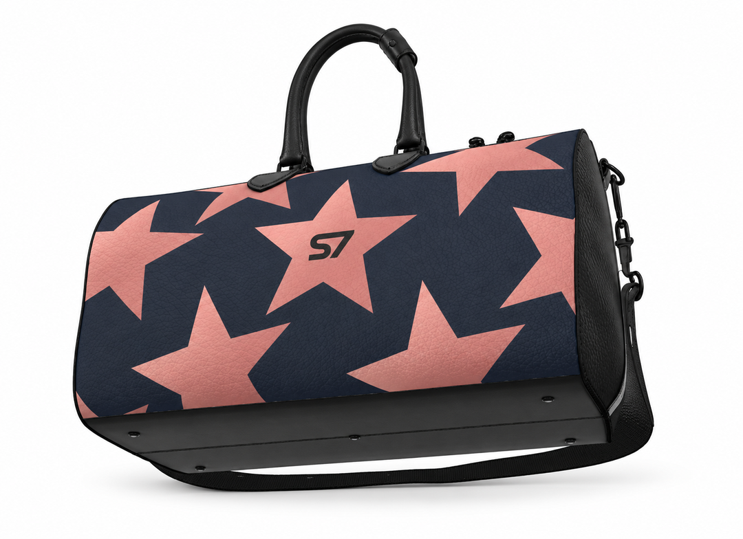 S7 Stella Midnight leather duffle bag with oversized rose-gold stars on midnight blue and a centered black S7 monogram.