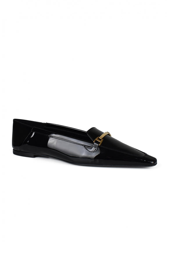 Black patent leather loafer with gold buckle on a white background