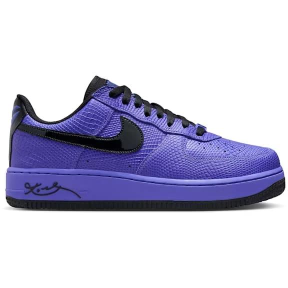 Purple sneaker with black accents on a white background