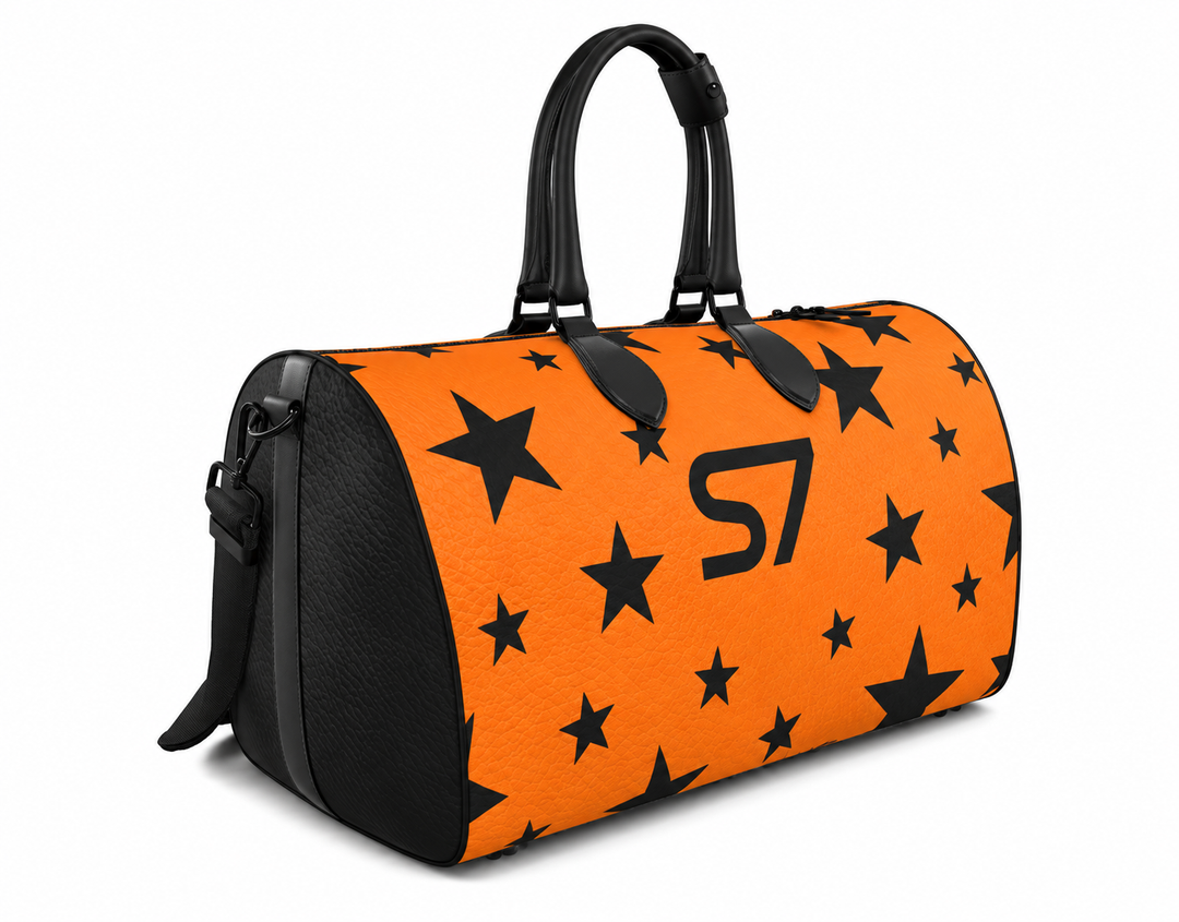 S7 Solar Noir orange leather duffle bag with scattered black five-point stars, a centered black S7 monogram and black handles and end panels.