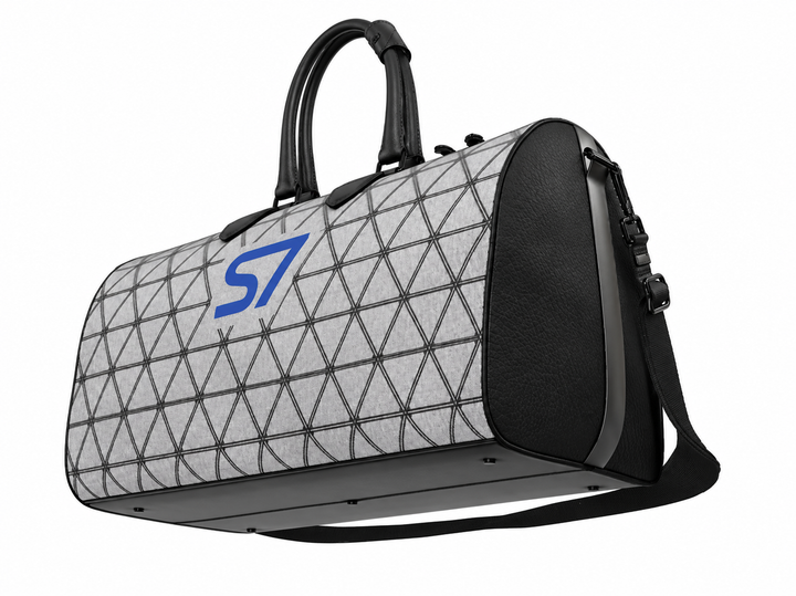 S7 PRISM duffle bag featuring black triangular lattice on a heather-gray background with a single cobalt-blue S7 logo.