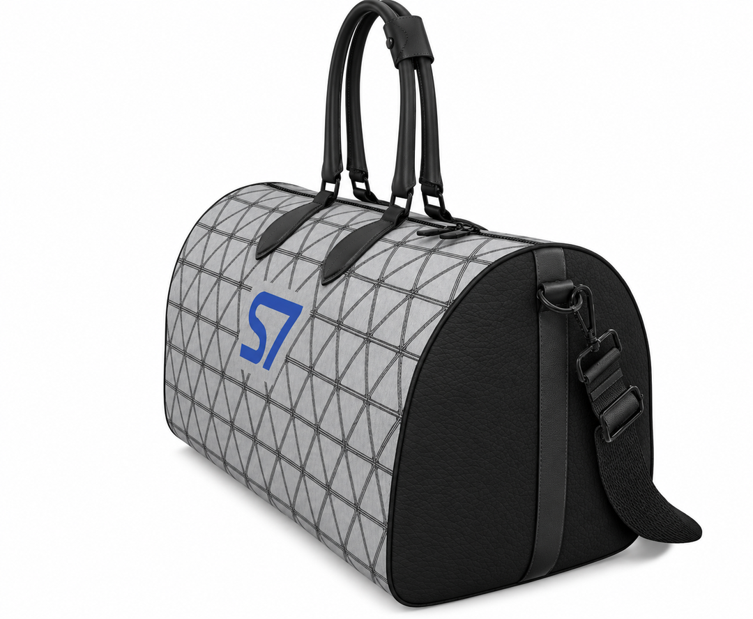 S7 PRISM duffle bag featuring black triangular lattice on a heather-gray background with a single cobalt-blue S7 logo.