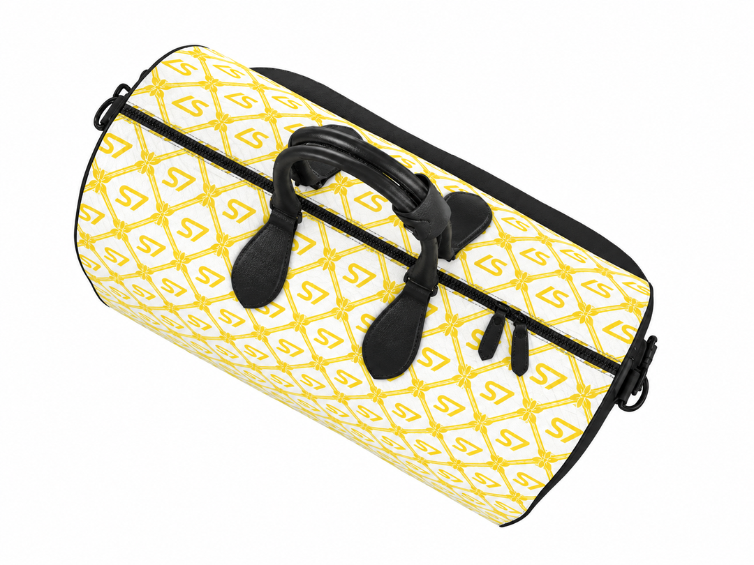 S7 Riviera Soleil duffle bag featuring bright yellow S7 monograms and ornate diamond lattice on a white background.