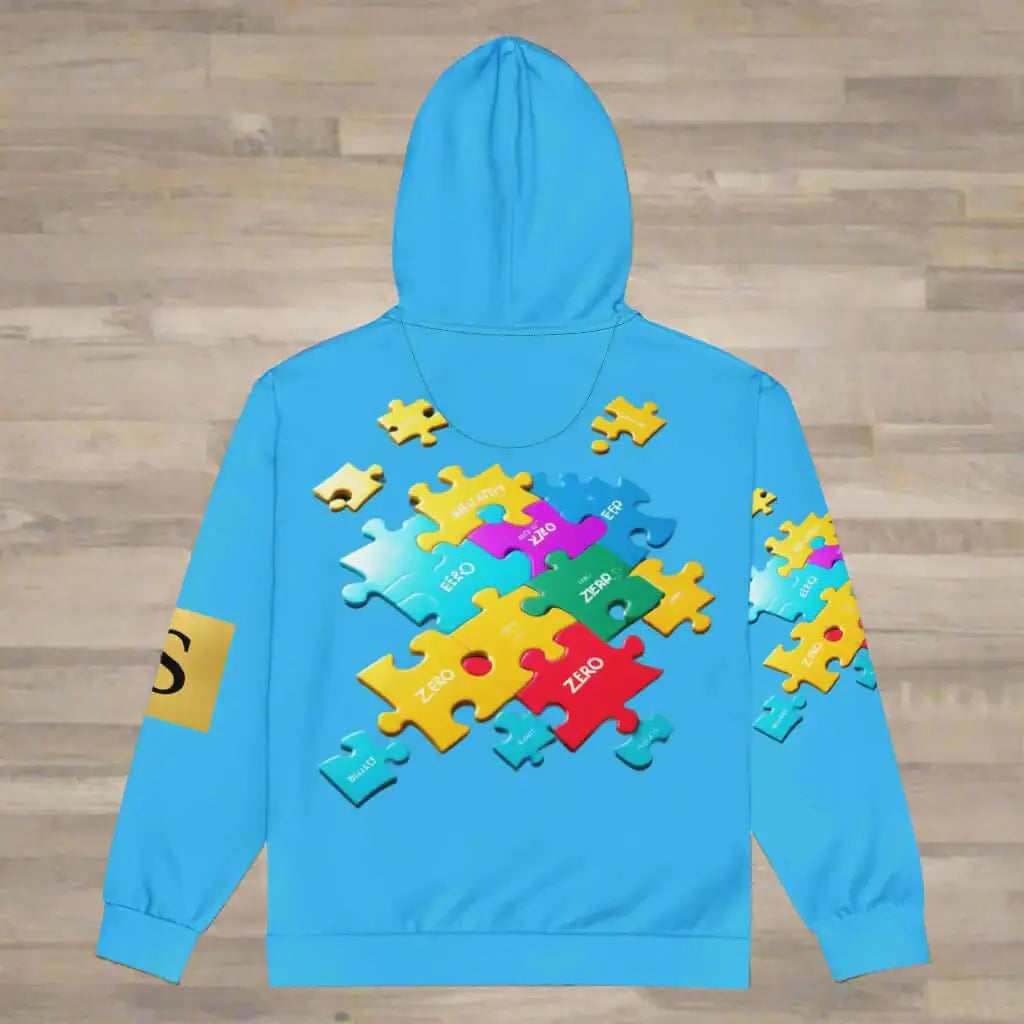 Blue hoodie with colorful puzzle piece design on a wooden floor background