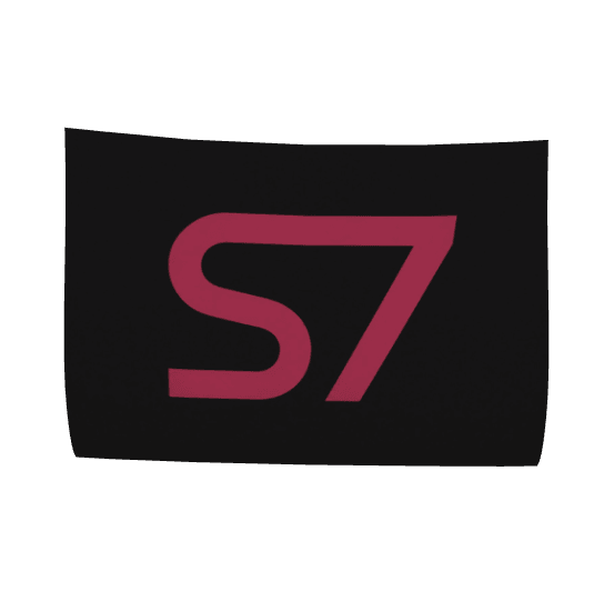 A black rectangular patch or sticker featuring a stylized pink &