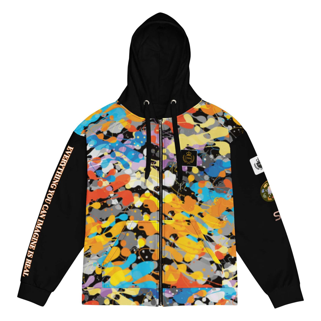 A black zip-up hoodie with a vibrant multicolor abstract paint splatter pattern across the chest and upper arms, featuring black sleeves with white text and patches.
