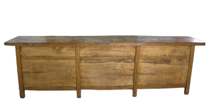 Wooden sideboard with three drawers on a white background