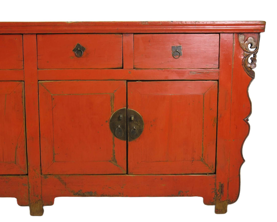 Red wooden cabinet with decorative elements on a white background