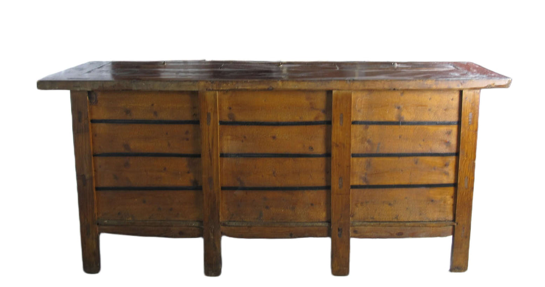 Wooden dresser with a marble top on a white background
