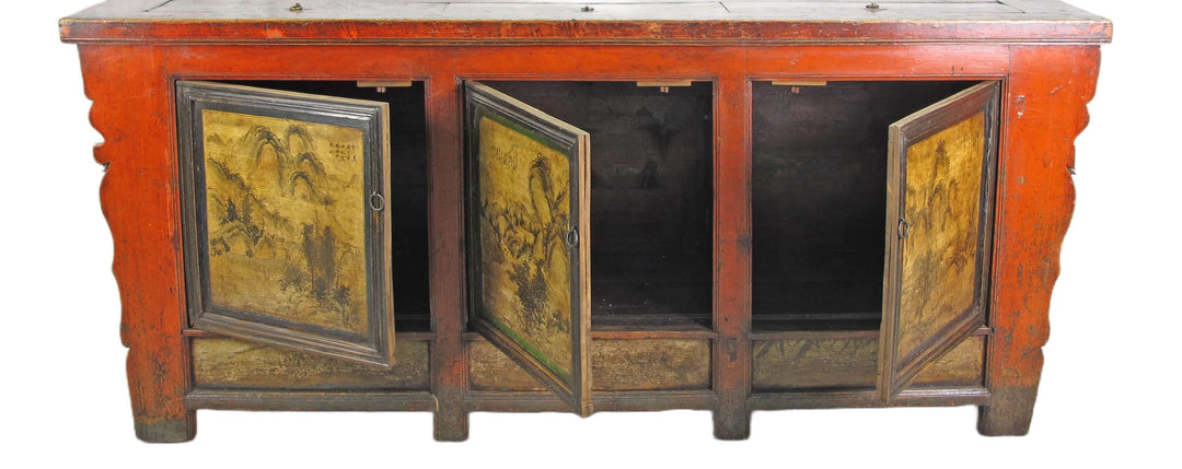 Vintage wooden cabinet with red paint and decorative doors on a white background