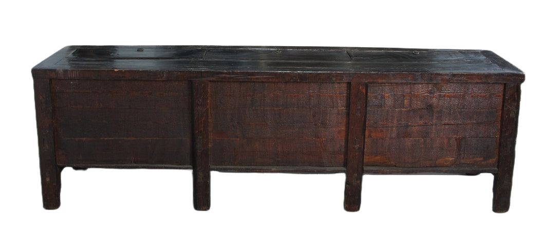 Vintage wooden sideboard with a dark brown finish on a white background