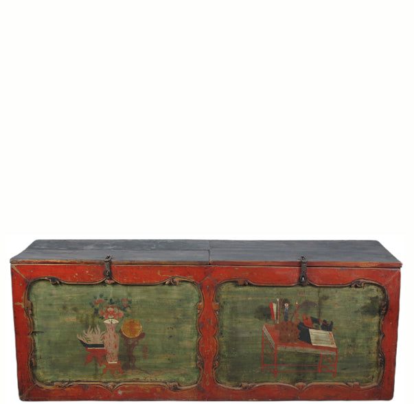Vintage wooden trunk with green and red paint on a white background