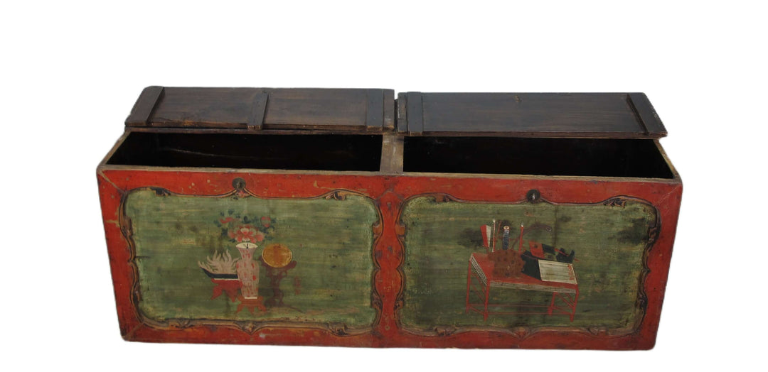 Vintage wooden trunk with painted designs on a white background