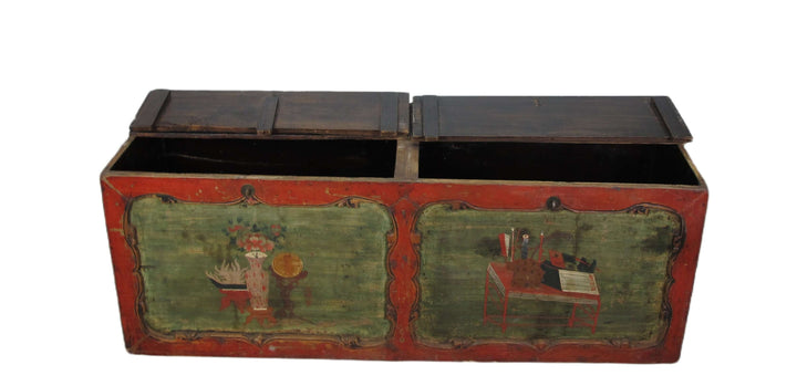 Vintage wooden trunk with painted designs on a white background