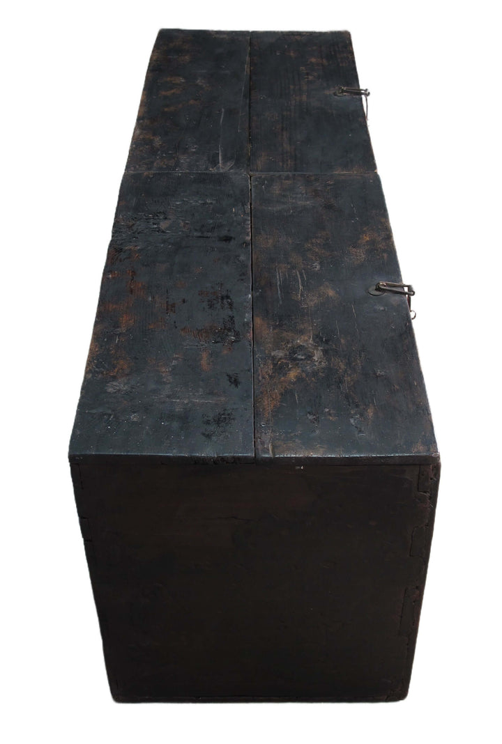 Rustic wooden bench with a dark, worn finish on a white background