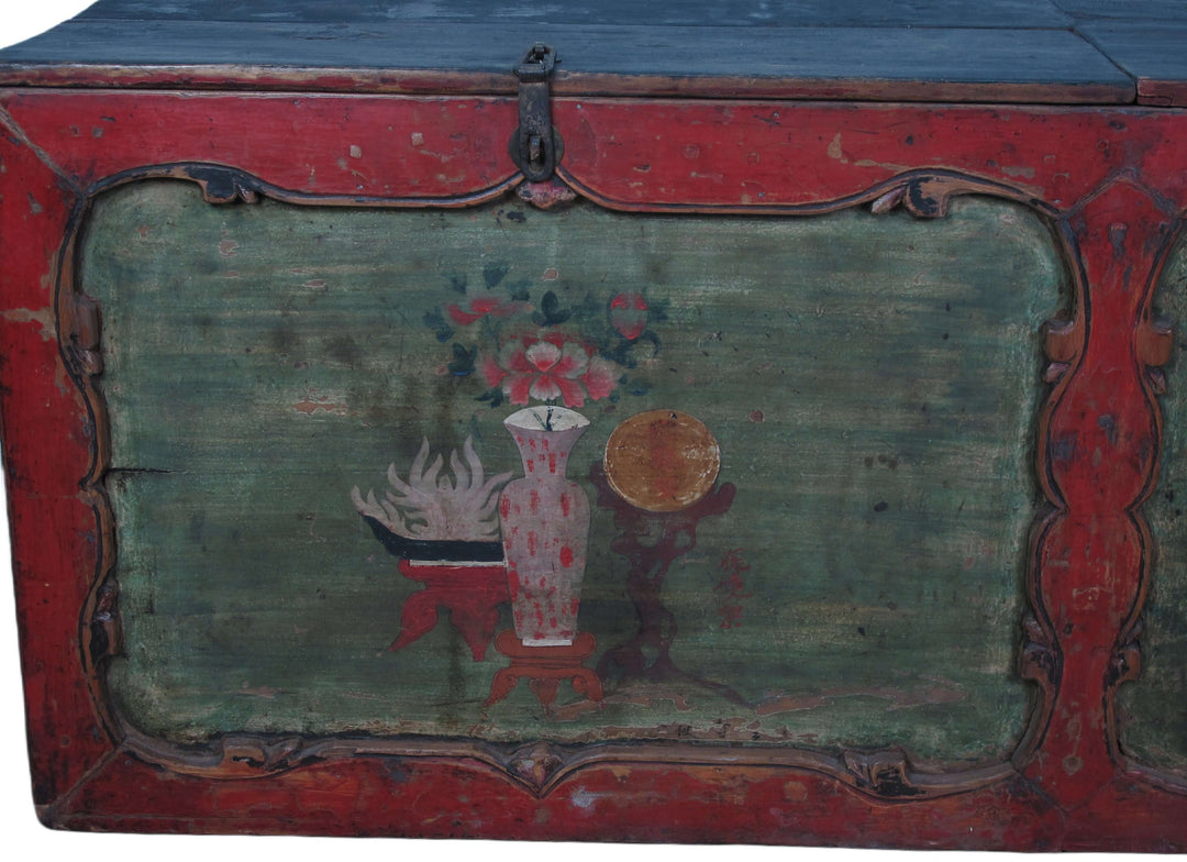 Vintage wooden trunk with decorative paint and floral design on a plain background