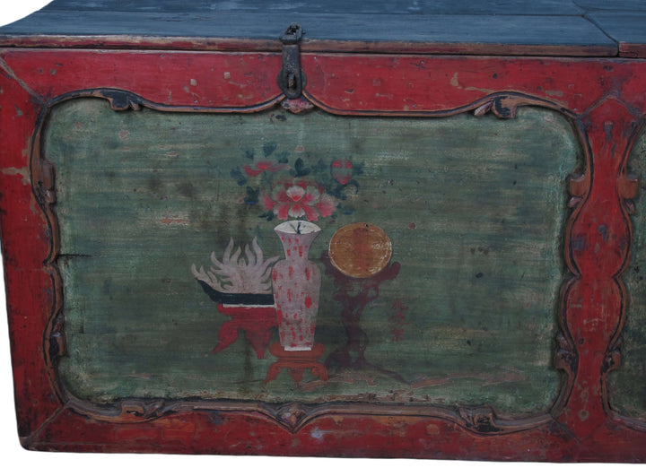 Vintage wooden trunk with decorative paint and floral design on a plain background