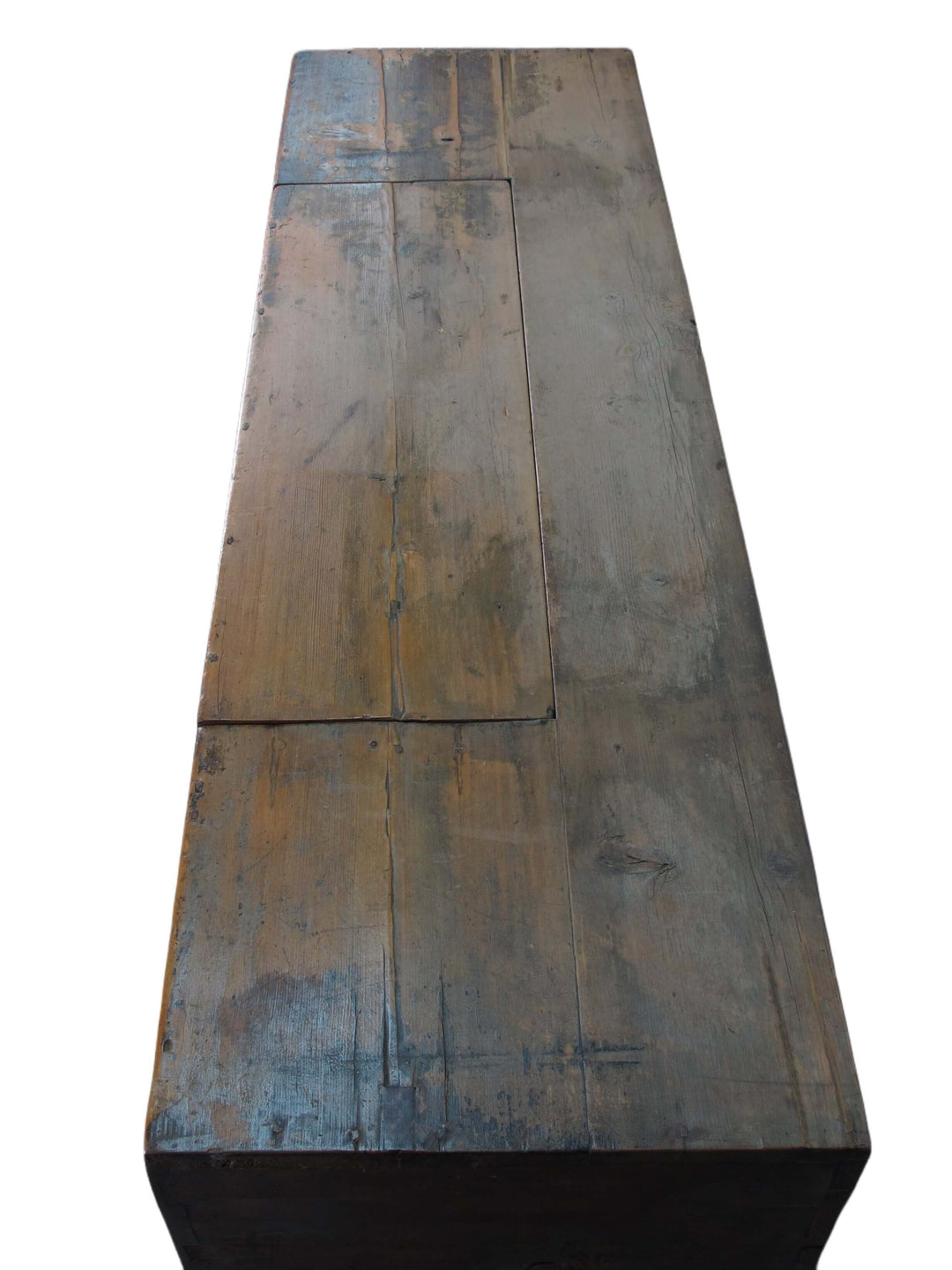 Rustic wooden table with a worn surface on a white background