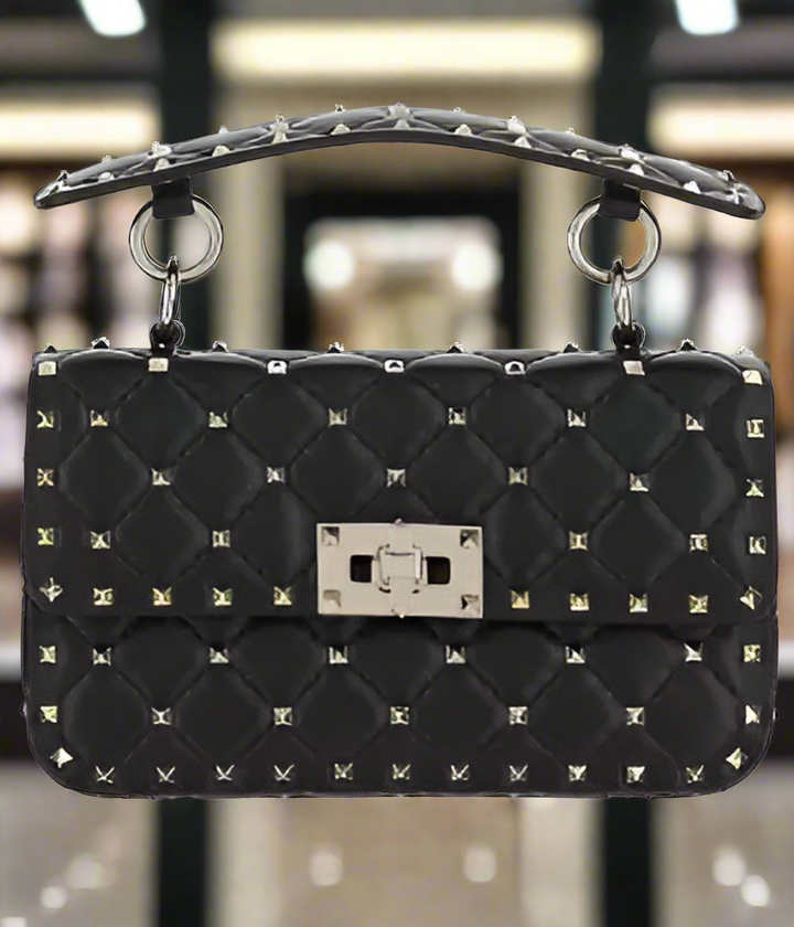 Valentino Garavani women's designer handbag in leather Luxury Valentino Garavani shoulder bag with iconic studs Valentino Garavani crossbody bag in black with gold accents