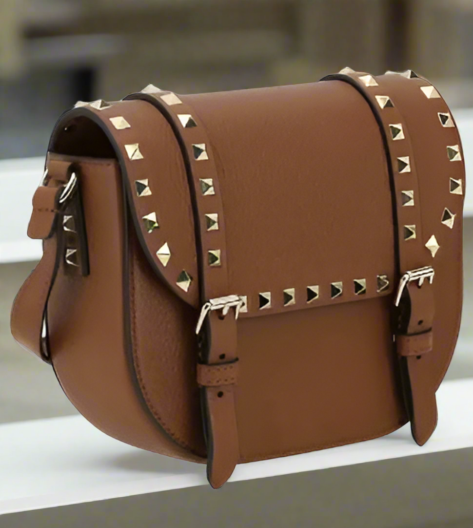 Valentino Garavani women's designer handbag in leather Luxury Valentino Garavani shoulder bag with iconic studs Valentino Garavani crossbody bag in black with gold accents