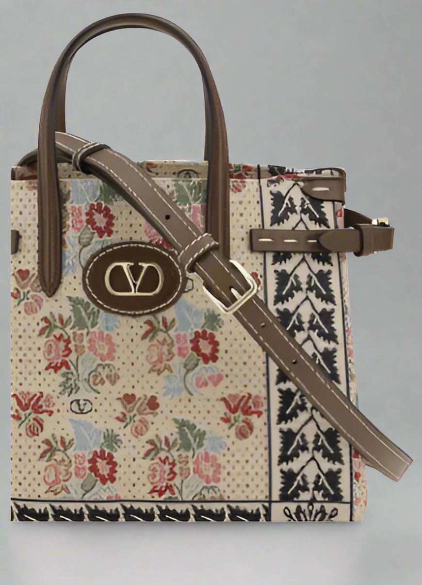Valentino Garavani women's designer handbag in leather Luxury Valentino Garavani shoulder bag with iconic studs Valentino Garavani crossbody bag in black with gold accents
