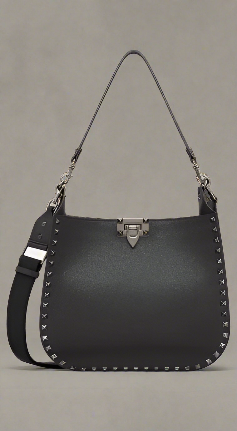 Valentino Garavani women's designer handbag in leather Luxury Valentino Garavani shoulder bag with iconic studs Valentino Garavani crossbody bag in black with gold accents