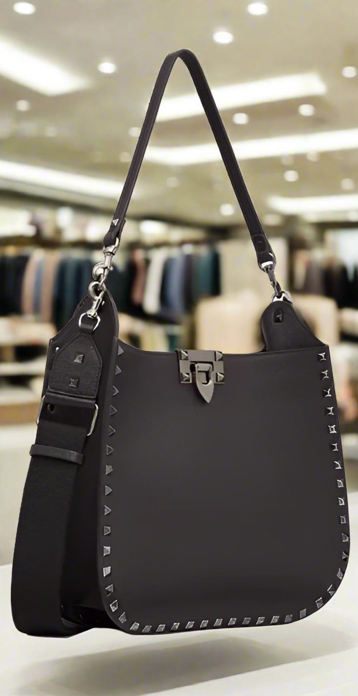 Valentino Garavani women's designer handbag in leather Luxury Valentino Garavani shoulder bag with iconic studs Valentino Garavani crossbody bag in black with gold accents