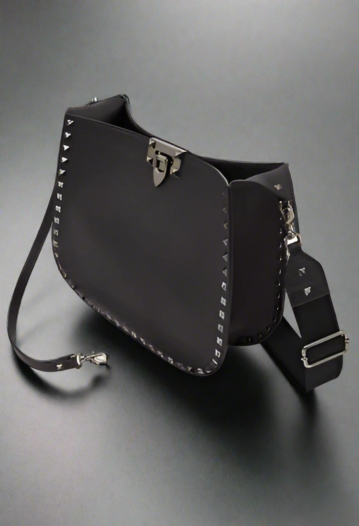 Valentino Garavani women's designer handbag in leather Luxury Valentino Garavani shoulder bag with iconic studs Valentino Garavani crossbody bag in black with gold accents