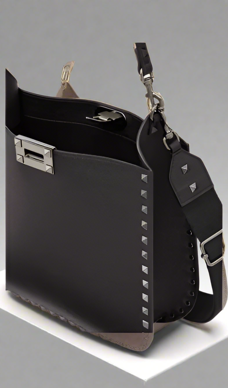 Valentino Garavani women's designer handbag in leather Luxury Valentino Garavani shoulder bag with iconic studs Valentino Garavani crossbody bag in black with gold accents