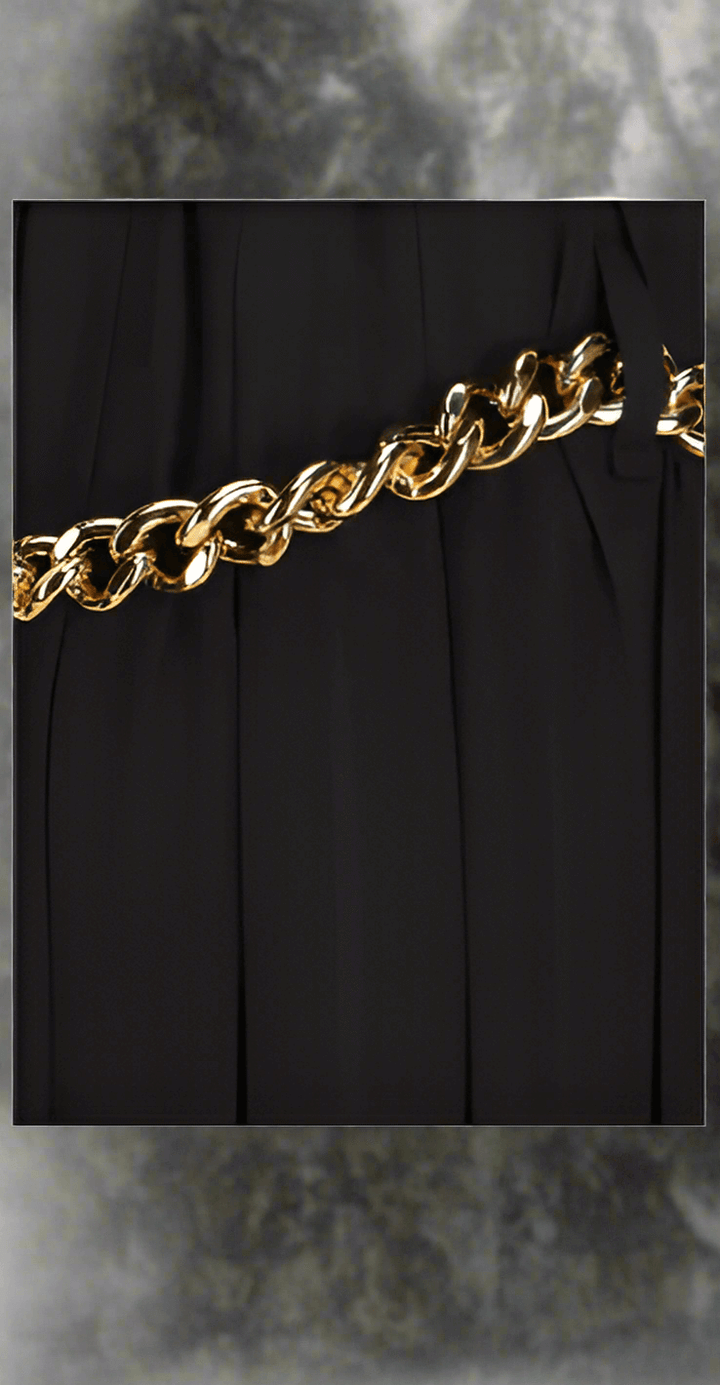 Balenciaga Long Skirt, elastic waistband, foot length, gold chain detail at waist.

