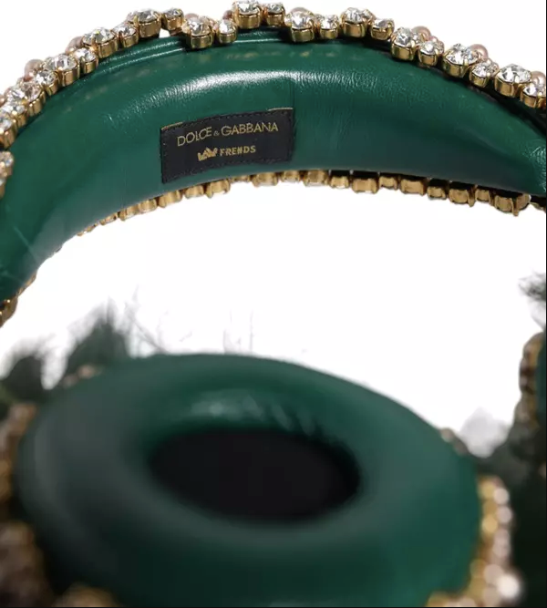 Green handbag with gold embellishments and Dolce & Gabbana logo.