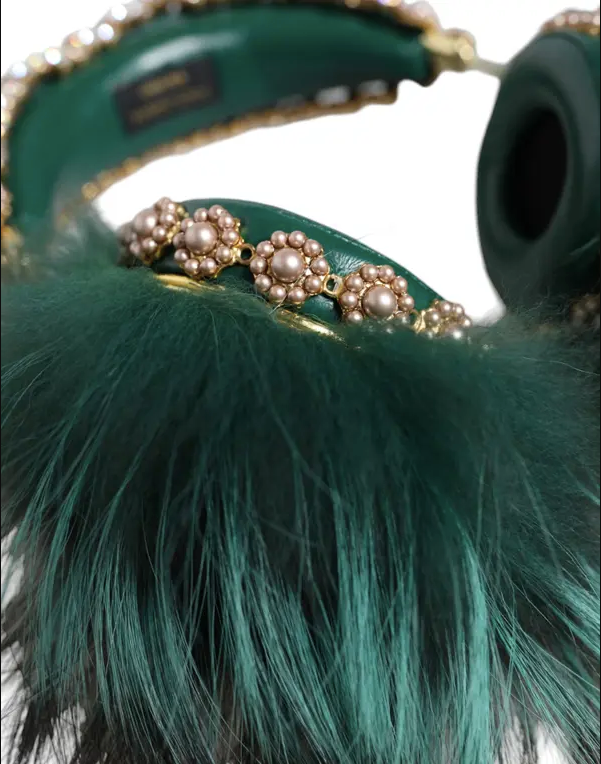 Green feathered handbag with gold accents and a visible brand label.