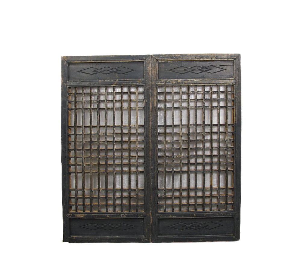 Vintage wooden screen with lattice design on a white background