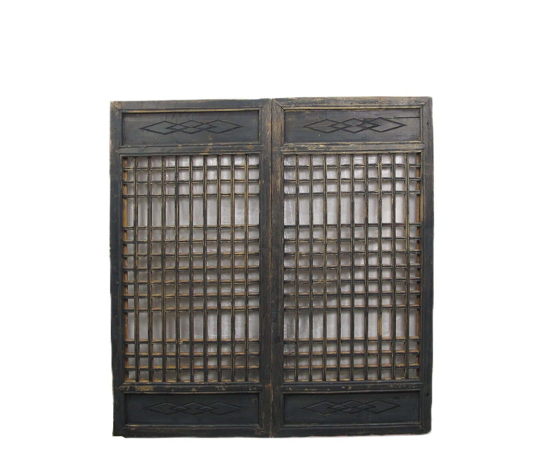 Vintage wooden screen with lattice design on a white background