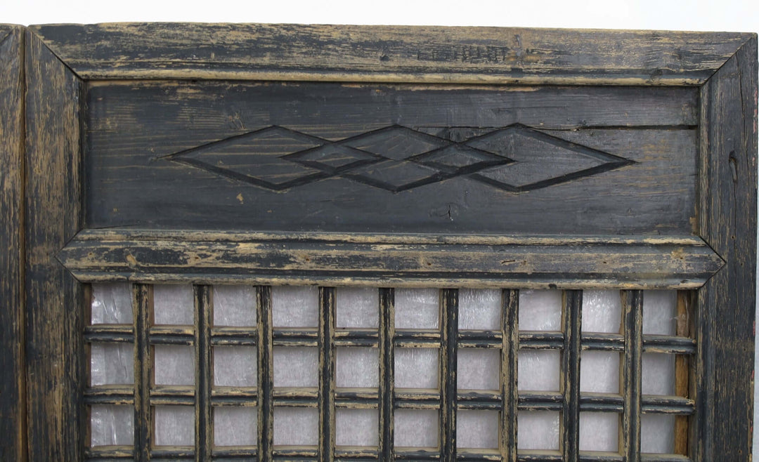 Decorative wooden panel with geometric patterns and glass panels