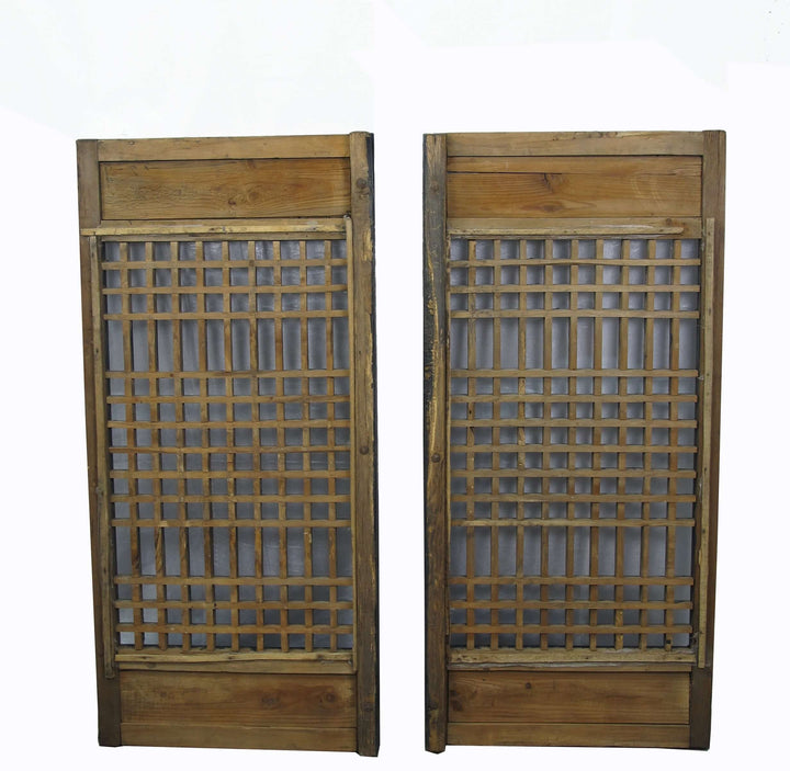 Pair of wooden lattice panels on a white background